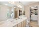 Bright bathroom boasting a double sink vanity, walk-in closet and a soaking tub with natural light at 145 Pier View St # 316, Charleston, SC 29492
