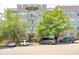 Apartment building exterior with lush greenery, several parked cars, and visible balconies, adding curb appeal at 145 Pier View St # 316, Charleston, SC 29492