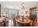 Elegant dining room featuring a round table, hardwood floors, and stylish decor creating an inviting atmosphere at 145 Pier View St # 316, Charleston, SC 29492