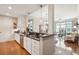 Bright kitchen featuring granite countertops, stainless steel appliances, and hardwood floors that open to the living room at 145 Pier View St # 316, Charleston, SC 29492