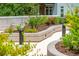 Lush green plants and foliage alongside a curved sidewalk at 145 Pier View St # 316, Charleston, SC 29492
