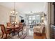 Cozy living space with a dining table, comfortable seating, and large windows offering natural light at 145 Pier View St # 316, Charleston, SC 29492