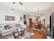 Bright and spacious living space with hardwood floors and an open layout connecting the living, dining, and kitchen areas at 145 Pier View St # 316, Charleston, SC 29492