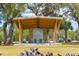 Inviting outdoor shelter with modern seating surrounded by mature trees, providing a relaxing gathering space at 145 Pier View St # 316, Charleston, SC 29492