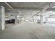 Well-lit indoor parking garage featuring multiple vehicles and marked parking spaces at 145 Pier View St # 316, Charleston, SC 29492