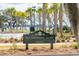 Welcoming sign for Waterfront Park at Daniel Island, with palm trees and a serene water view at 145 Pier View St # 316, Charleston, SC 29492