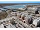 Scenic aerial view showcasing community buildings and local roadways near the waterfront at 150 Bee St # 714, Charleston, SC 29401