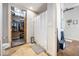 Bathroom featuring a walk-in shower, toilet, and view of a closet, blending style and functionality at 150 Bee St # 714, Charleston, SC 29401