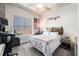 Bedroom features a cozy bed, window with blinds, and tasteful decor, including concrete ceiling at 150 Bee St # 714, Charleston, SC 29401