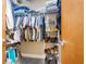 Organized closet with shelves and hanging rods offering ample storage for clothing and accessories at 150 Bee St # 714, Charleston, SC 29401