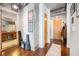 Inviting hallway entrance with modern lighting, concrete accents, and convenient bathroom access at 150 Bee St # 714, Charleston, SC 29401