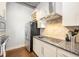 Modern kitchen featuring sleek appliances, granite countertops, and custom cabinetry at 150 Bee St # 714, Charleston, SC 29401