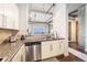 Modern kitchen with stainless steel appliances, granite countertops, and open layout to the living space at 150 Bee St # 714, Charleston, SC 29401