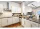Stylish kitchen showcasing stainless appliances, tile backsplash, and granite countertops at 150 Bee St # 714, Charleston, SC 29401