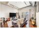 Sun-filled living room with balcony access, plush seating, and stylish furnishings at 150 Bee St # 714, Charleston, SC 29401