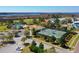 Aerial view featuring a community pool, tennis courts, and playground near marshland at 1717 Rivertowne Country Club Dr, Mount Pleasant, SC 29466