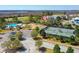 Scenic aerial view of a neighborhood with a community pool, playground, and tennis courts at 1717 Rivertowne Country Club Dr, Mount Pleasant, SC 29466