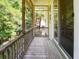 Relaxing screened-in back porch with wooded views and comfortable space for outdoor enjoyment at 1717 Rivertowne Country Club Dr, Mount Pleasant, SC 29466