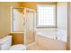 Bathroom featuring a soaking tub and a glass shower at 1717 Rivertowne Country Club Dr, Mount Pleasant, SC 29466