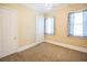 Bedroom features carpet, closet, and bright natural light from the windows at 1717 Rivertowne Country Club Dr, Mount Pleasant, SC 29466