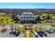 Beautiful community building with white columns and multiple parking spaces in a park-like setting at 1717 Rivertowne Country Club Dr, Mount Pleasant, SC 29466