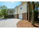 Exterior elevation shows the home's back, garages, and outdoor living space at 1717 Rivertowne Country Club Dr, Mount Pleasant, SC 29466