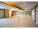 Spacious unfinished garage with room for multiple cars and storage with roll up door at 1717 Rivertowne Country Club Dr, Mount Pleasant, SC 29466
