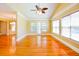 Open-concept living room showcasing hardwood floors, vaulted ceiling, and large windows for natural light at 1717 Rivertowne Country Club Dr, Mount Pleasant, SC 29466