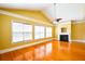 Bright living room with gleaming wood floors and a fireplace at 1717 Rivertowne Country Club Dr, Mount Pleasant, SC 29466