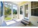 Charming screened-in porch with painted wood floor, offering views of the surrounding greenery at 1717 Rivertowne Country Club Dr, Mount Pleasant, SC 29466