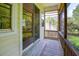 Screened porch with wood flooring at 1717 Rivertowne Country Club Dr, Mount Pleasant, SC 29466