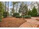 Landscaped backyard featuring a brick pathway lined with lush greenery at 221 Church St, Mount Pleasant, SC 29464
