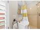 Bathroom with shower/tub combo, white vanity and ample natural light at 221 Church St, Mount Pleasant, SC 29464