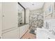 Bathroom showcasing a large built in cabinet, patterned tile floors, and a shower curtain at 221 Church St, Mount Pleasant, SC 29464