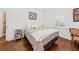 Cozy bedroom featuring hardwood floors, natural light, and neutral color palette at 221 Church St, Mount Pleasant, SC 29464