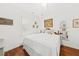 Bedroom featuring bright walls, hardwood floors, natural light, and comfortable furniture at 221 Church St, Mount Pleasant, SC 29464
