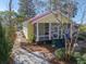 Charming cottage-style home with a screened porch and inviting walkway at 221 Church St, Mount Pleasant, SC 29464