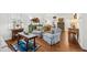 Elegant living room with hardwood floors, stylish furnishings, and ample natural light at 221 Church St, Mount Pleasant, SC 29464
