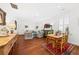 Open-concept living space with hardwood floors and plenty of room for dining at 221 Church St, Mount Pleasant, SC 29464