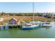 Scenic view of sailboats and houses with a pathway through the marsh at 232 Haddrell St, Mount Pleasant, SC 29464