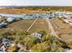 Scenic aerial view of the harbor and the charming homes nestled among the trees at 232 Haddrell St, Mount Pleasant, SC 29464