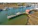Scenic view of boats docked by a charming building along the tranquil waterway at 232 Haddrell St, Mount Pleasant, SC 29464