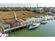 Aerial view of boats docked with houses and a pathway stretching through the marsh at 232 Haddrell St, Mount Pleasant, SC 29464