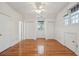 Bright bedroom with hardwood floors, ceiling fan, and multiple closets offers ample storage at 232 Haddrell St, Mount Pleasant, SC 29464