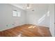 Bright bedroom with hardwood floors, ceiling fan, closet, and plenty of natural light at 232 Haddrell St, Mount Pleasant, SC 29464