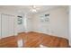 Bright bedroom with hardwood floors, ceiling fan, natural light, and closet space at 232 Haddrell St, Mount Pleasant, SC 29464