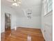 Bright bedroom featuring hardwood floors, ceiling fan, and natural light from two windows at 232 Haddrell St, Mount Pleasant, SC 29464