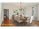 Staged dining room with a wooden table and six chairs at 232 Haddrell St, Mount Pleasant, SC 29464