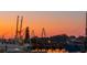 Picturesque harbor scene with fishing boats, a dock and distant bridge at sunset at 232 Haddrell St, Mount Pleasant, SC 29464