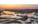 Picturesque harbor with boats, docks, and a distant bridge illuminated at sunset at 232 Haddrell St, Mount Pleasant, SC 29464